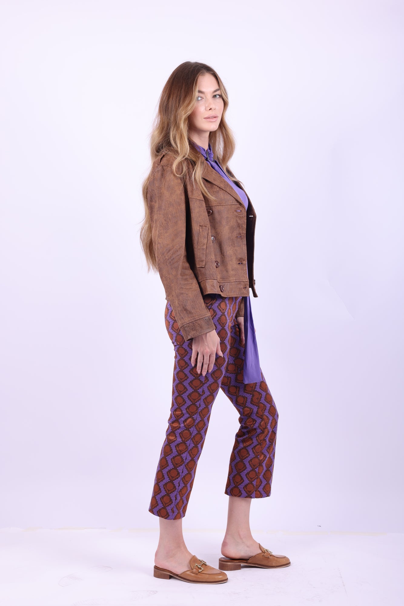 Side pose of model in Siste's Double-Breasted Jacket showcasing button details