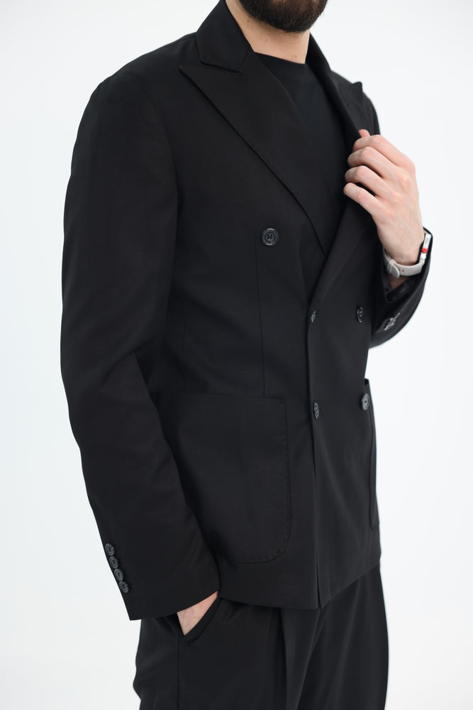 Tela N black men’s suit model wearing blazer close up view