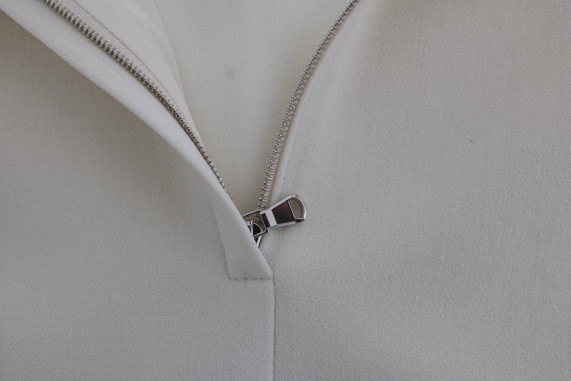 فستان دولتشي آند غابانا الأبيض المصنوع من الصوف المطاطي مع بروش