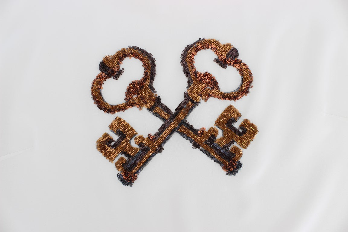 بلوزة تي شيرت من دولتشي آند غابانا باللون الأبيض مع ترتر من الحرير