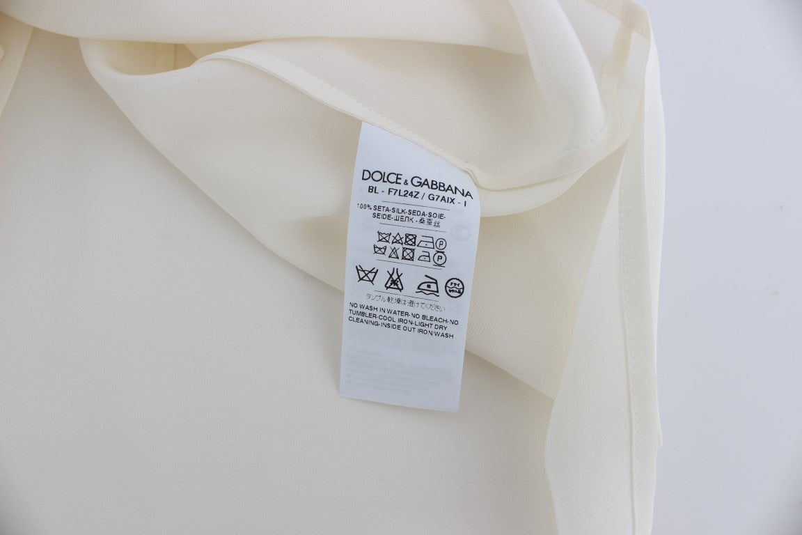 بلوزة تي شيرت من دولتشي آند غابانا باللون الأبيض مع ترتر من الحرير