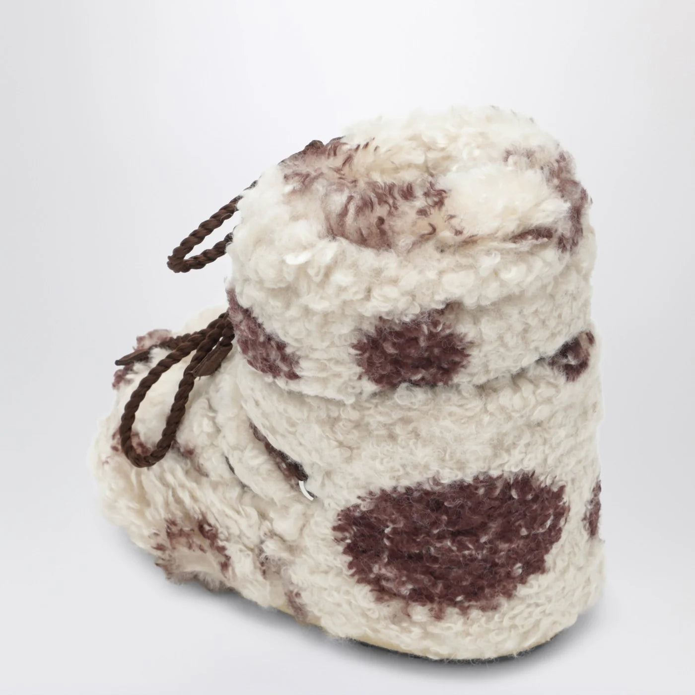 Moon Boot Icon Low curly boot with cow print