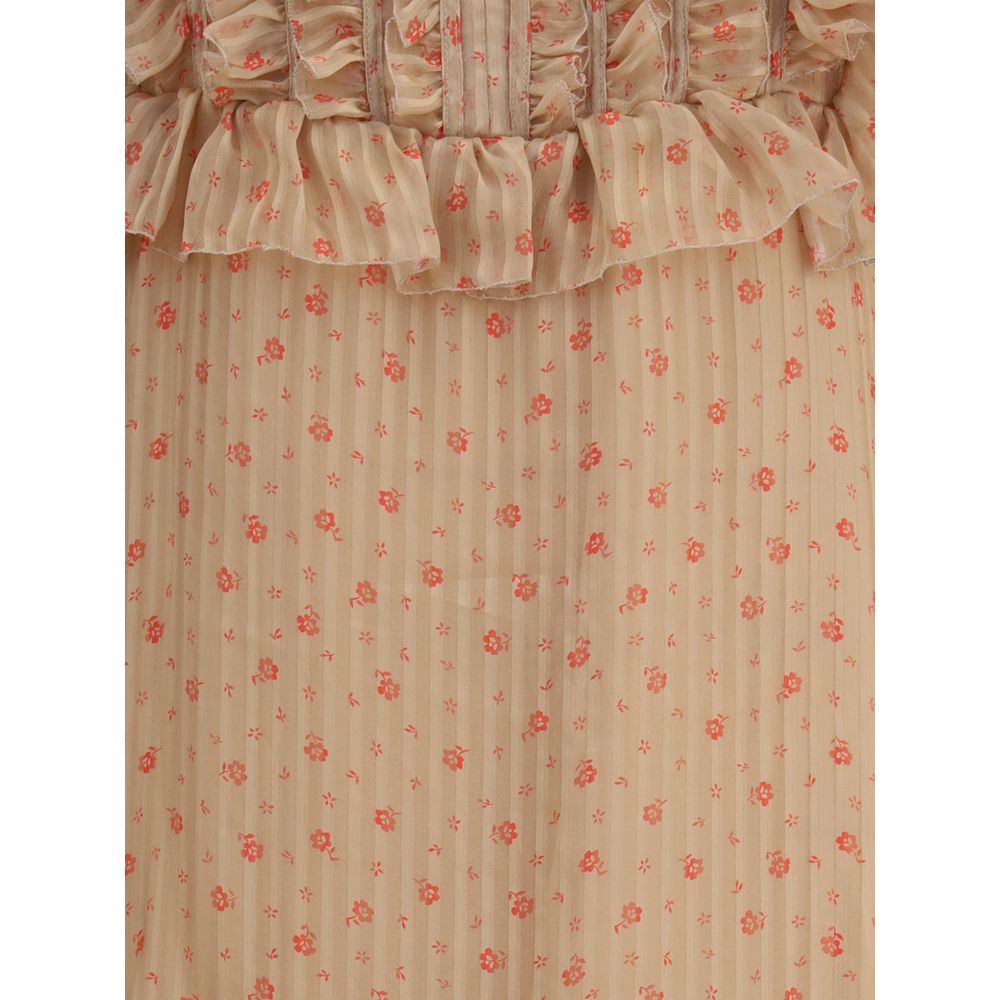 فستان كريستينا تي الحريري الطويل مع الكشكشة