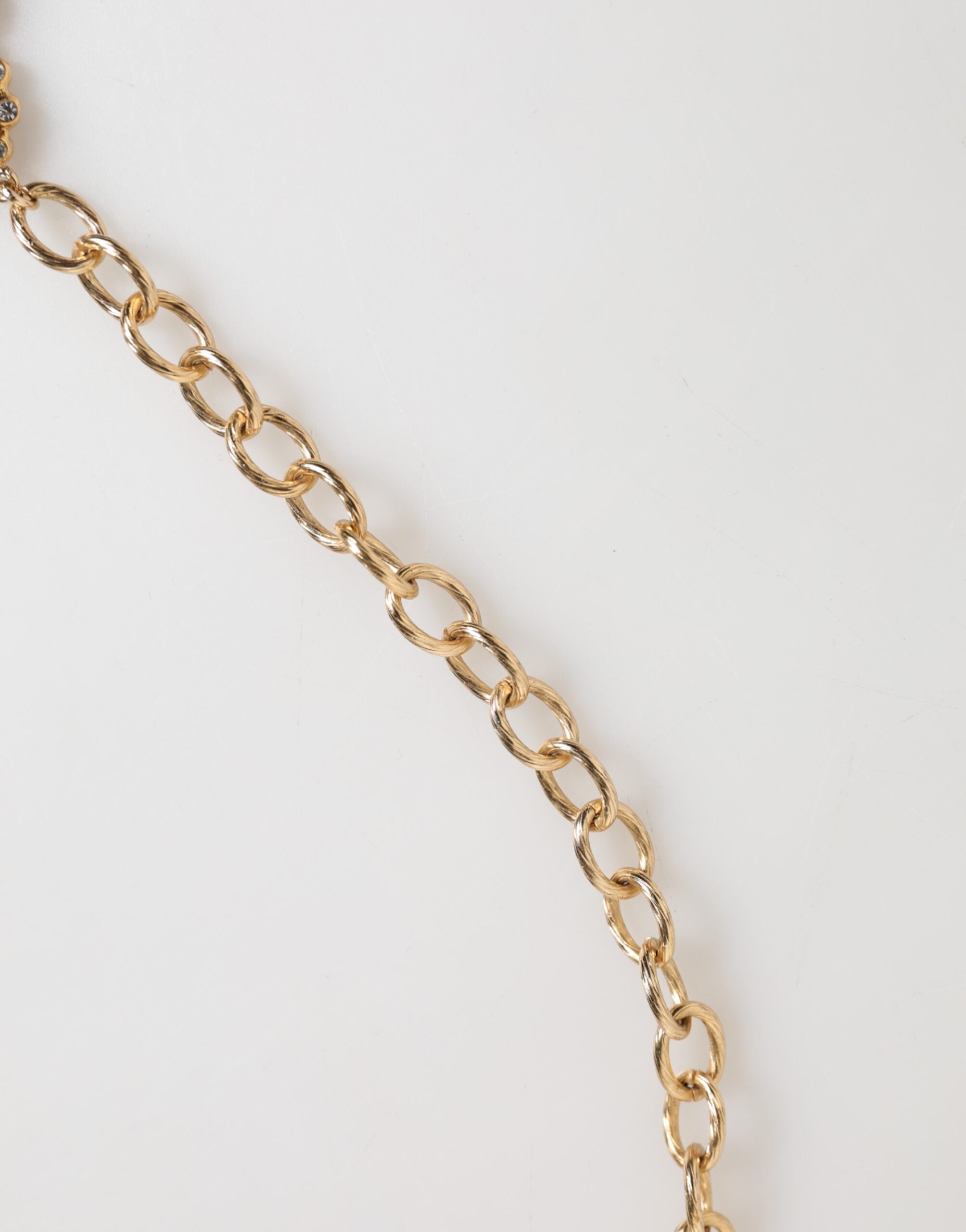 قلادة دولتشي آند غابانا الذهبية الكريستالية على شكل ساعة