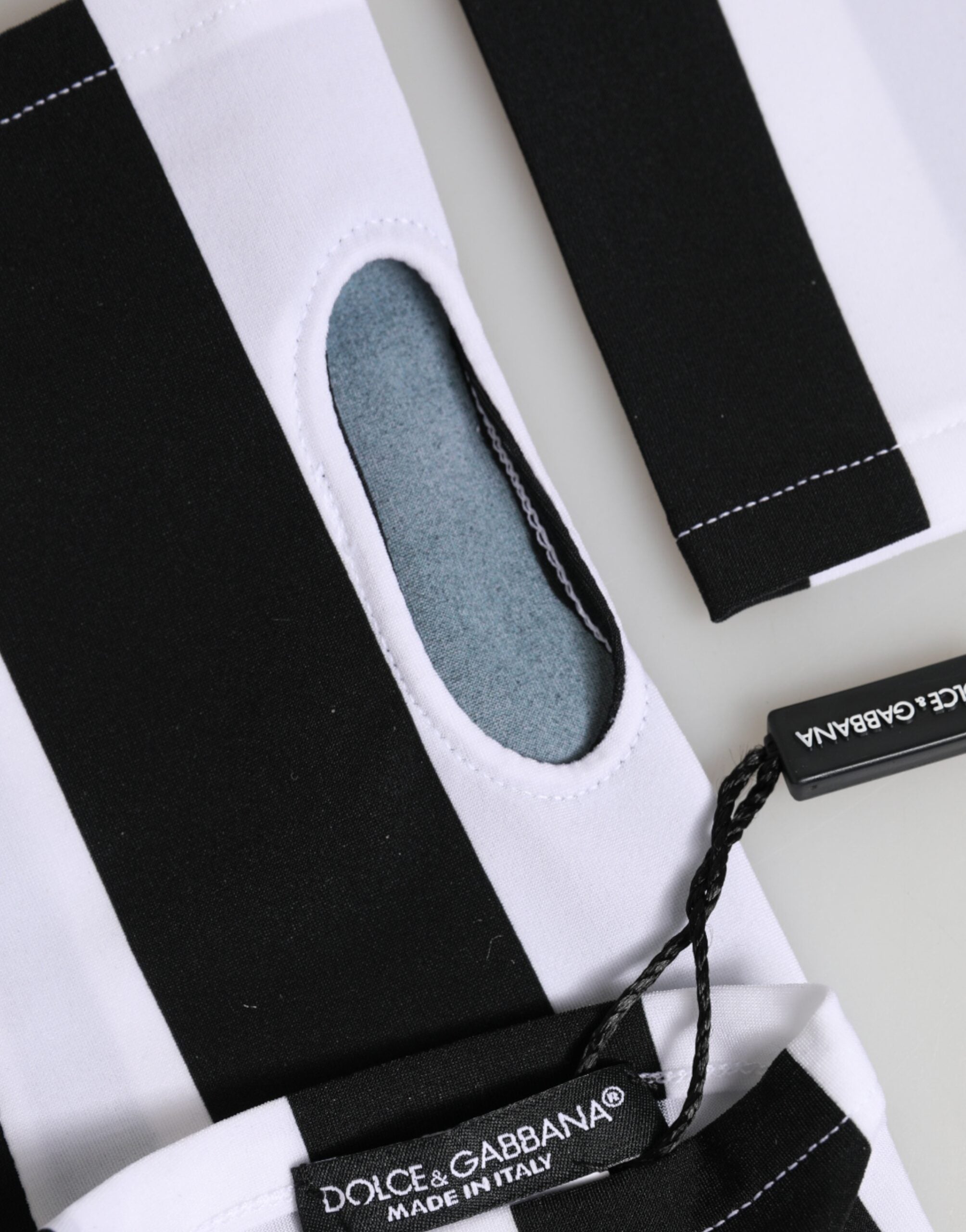 قفازات دولتشي آند غابانا من النايلون الأسود والأبيض بدون أصابع بطول المعصم