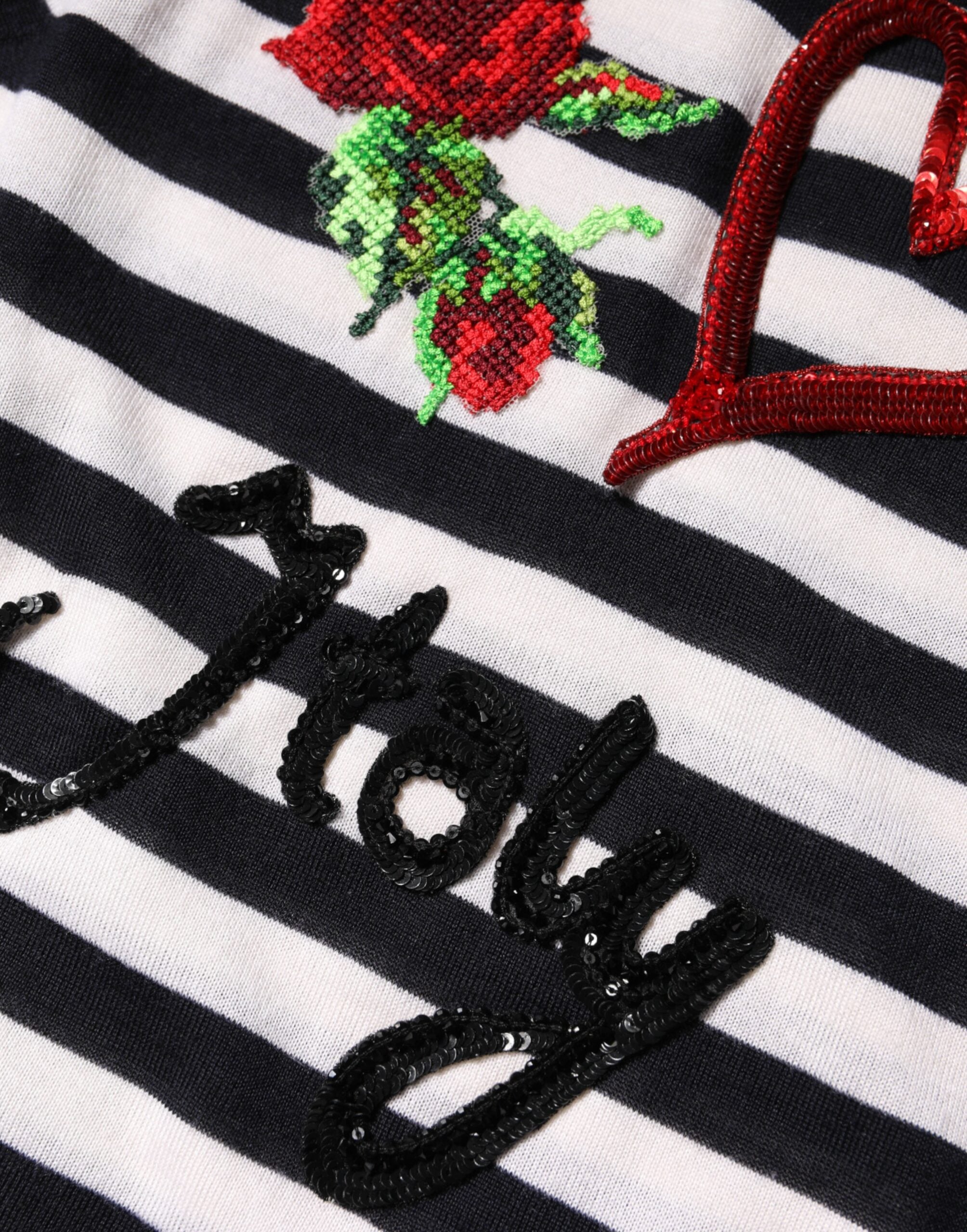 بلوزة دولتشي آند غابانا بدون أكمام من الحرير الكشمير باللونين الأبيض والأسود