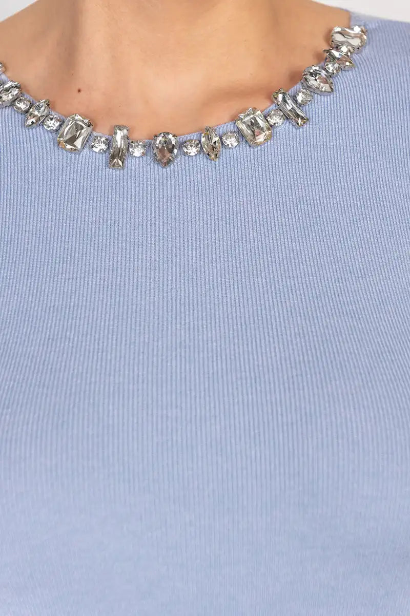 Close-up of crystal-embellished neckline on Siste's Jewel Necklace Dress in Polvere