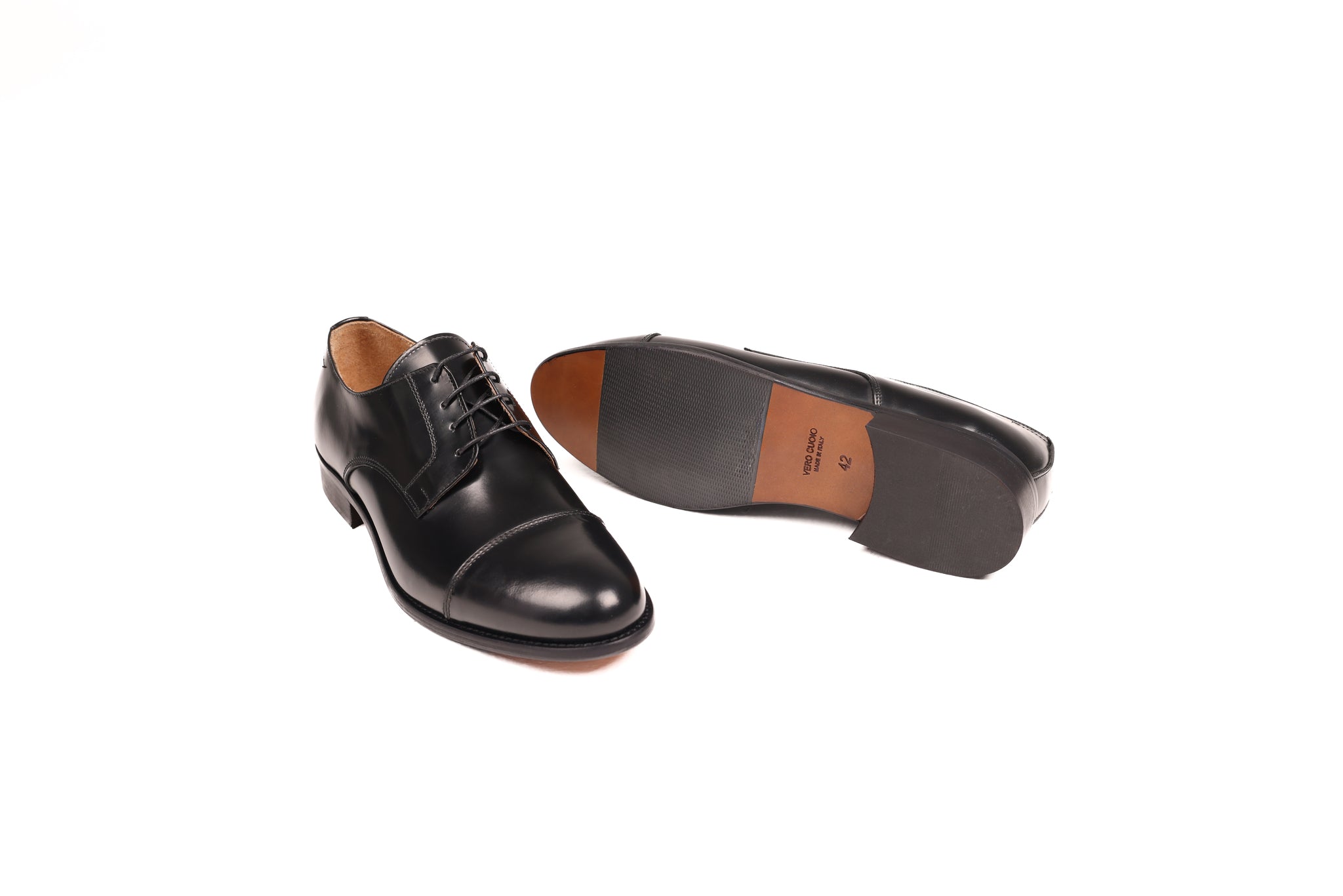 Angled view of Bardigiani polished black leather shoes