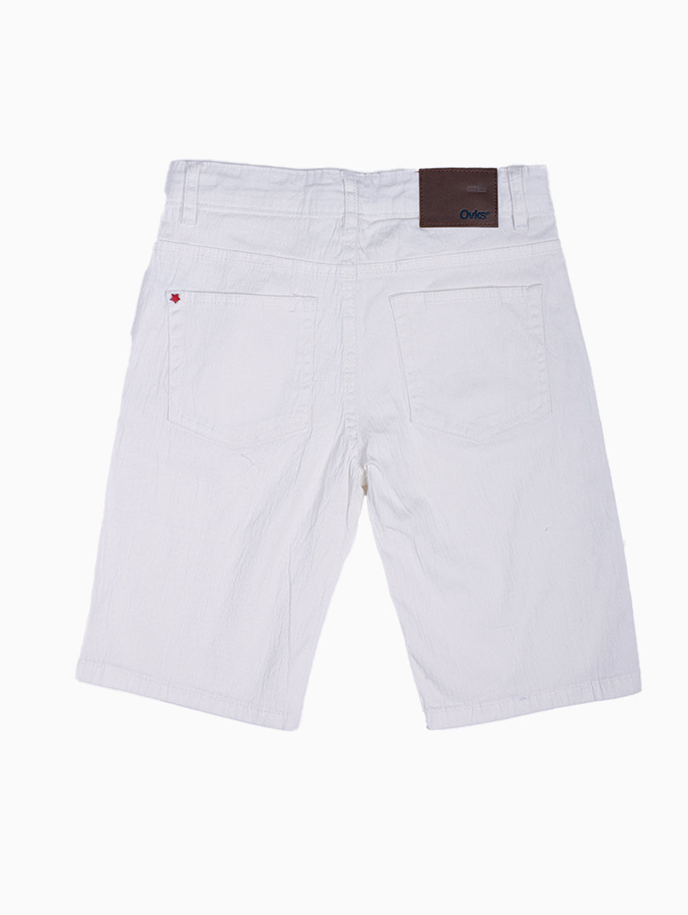 Flat lay of OVKS white boys shorts showcasing side pockets and tailored fit.