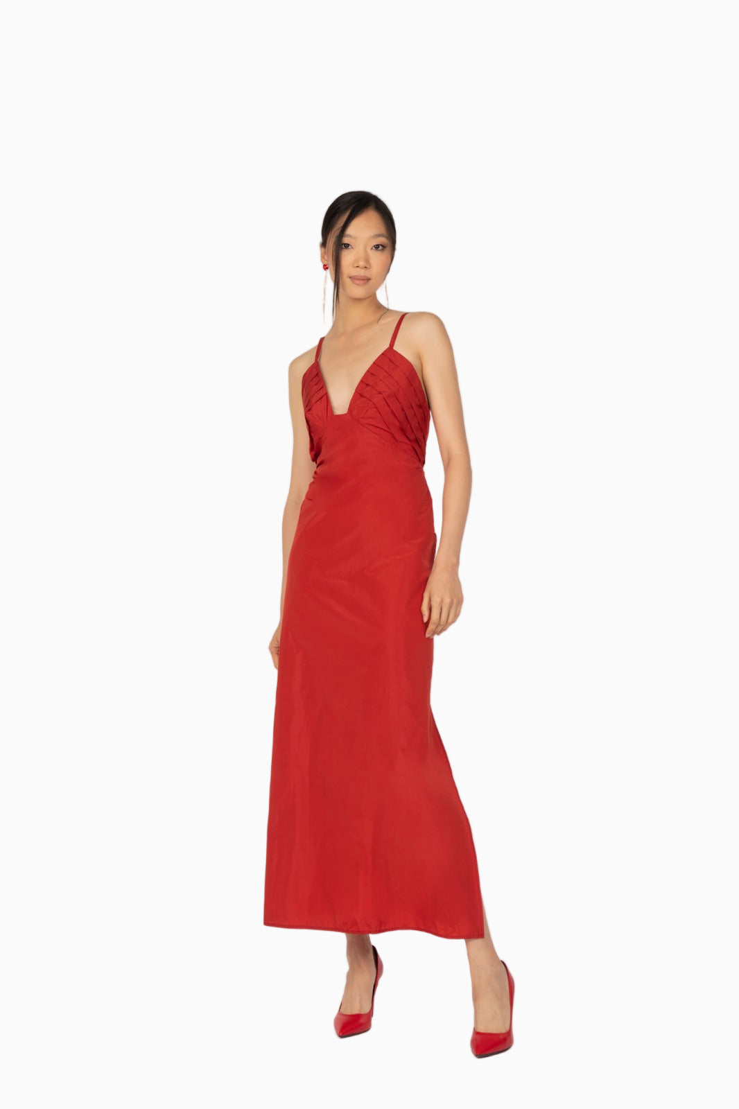 Model wearing Siste’s red silk evening dress full length