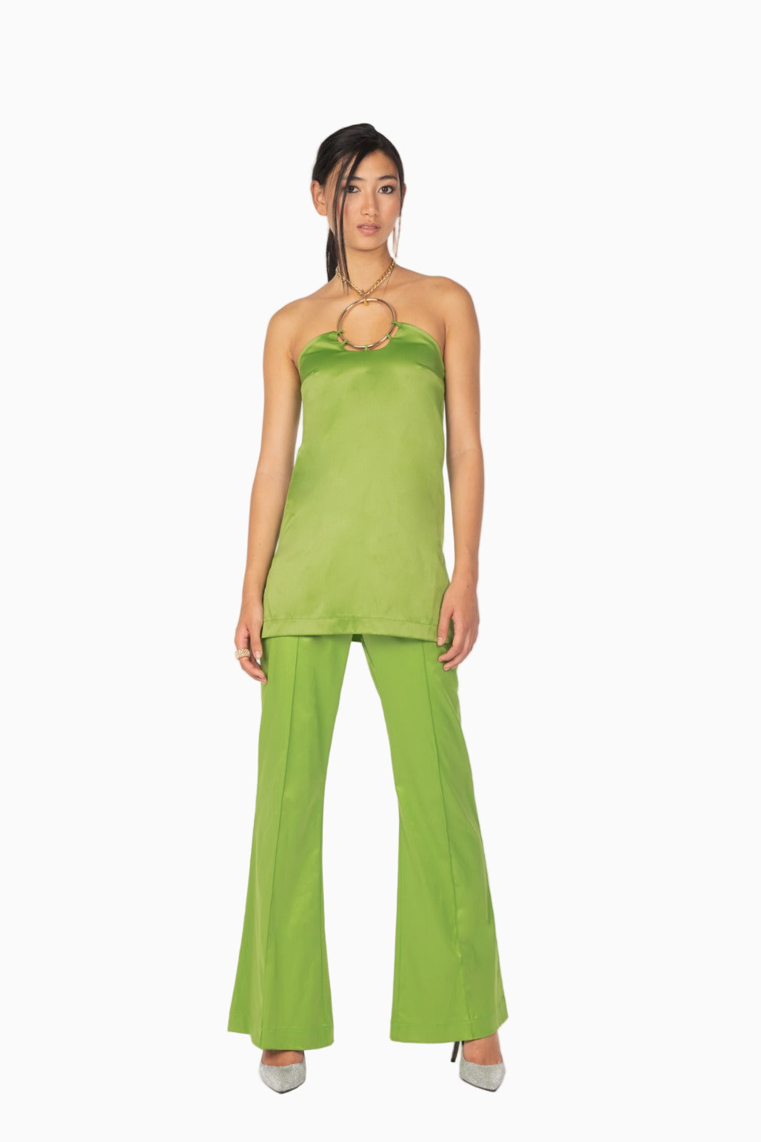 Model wearing Siste’s green halter top and flared pants set – Luxe Marca.